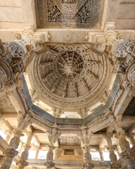 Fototapeta premium Architectural detail and sculpture of historic Jain temple in Ranakpur, Rajasthan, India. The temple was built in 1496.