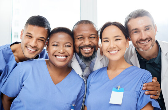 Medical, portrait of doctors and happy together at hospital or clinic with smile. Diversity, medical team for healthcare and excited or cheerful group of nurse or surgeons smiling for health wellness