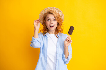 Girl posing with chocolate ice cream on yellow isolated background. Summer woman. Amazed surprised...
