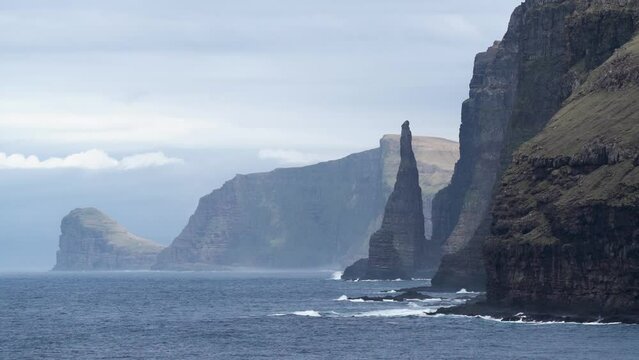 Waves Onto Rock Cliffs In Oknadalsdrangur, Sandoy, Faroe Islands, Denmark. Timelapse