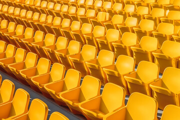 Fototapeta na wymiar Yellow tribunes. Empty seats on tribune at sport stadium. Generative AI