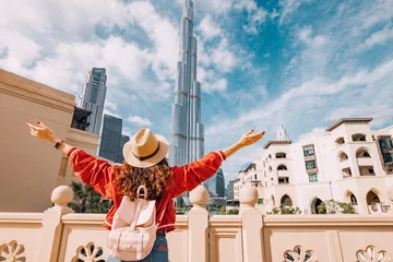 Cercles muraux Dubai Happy girl arms are outstretched, as she embracing the incredible view before her in Dubai, UAE