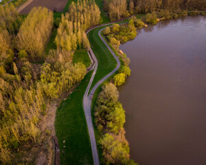 Bike path along the Scheldt river. Aerial view