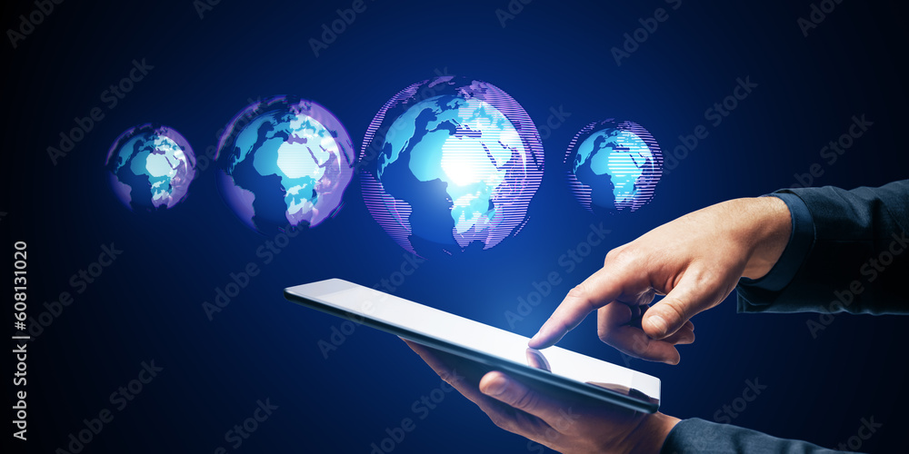 Aufkleber close up of male hand using cellphone with glowing digital globe hologram on dark background. digita
