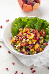 Portion of gourmet healthy fresh salad with tomatoes