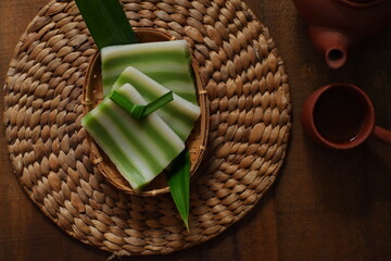 kue lapis in wooden background 