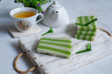 kue lapis or traditional layer cake and a cup of tea