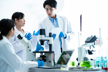 Scientists discussing progress in the laboratory