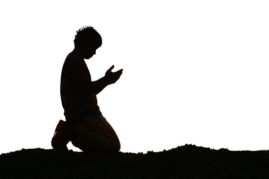 Silhouette of man praying on a transparent 