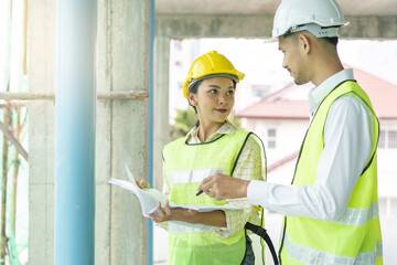 Builder inspection consultancy. Two engineer consulting and checking material and structure in construction.