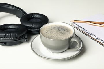 Obraz na płótnie Canvas Concept of freelance, composition with hot drink and headphones