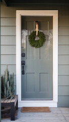 Back door with a wreath on the facade of a cozy country house or cottage. AI generated