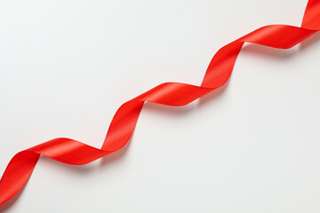 Concept of different ribbons, red ribbon on white background