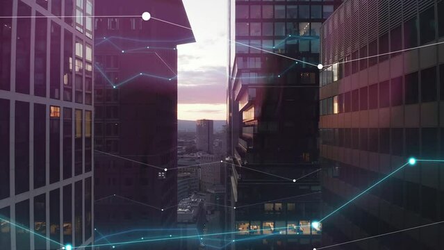 Forwards fly between modern high rise downtown office buildings against twilight sky. Digital lines and charts, analysing collected data visual effects. Frankfurt, Germany