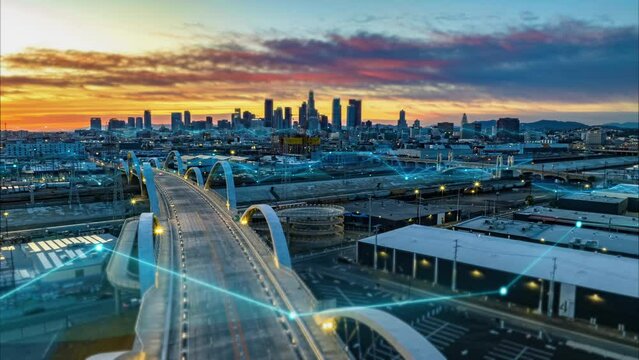 Hyperlapse shot of urban borough and modern road bridge over river against sunset sky. Digital lines and charts, analysing collected data visual effects. Los Angeles, California, USA