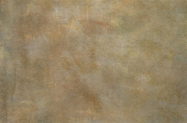 An old, grunge floor with a rough, beige and brown textured pattern provides an abstract background with plenty of copy space.
