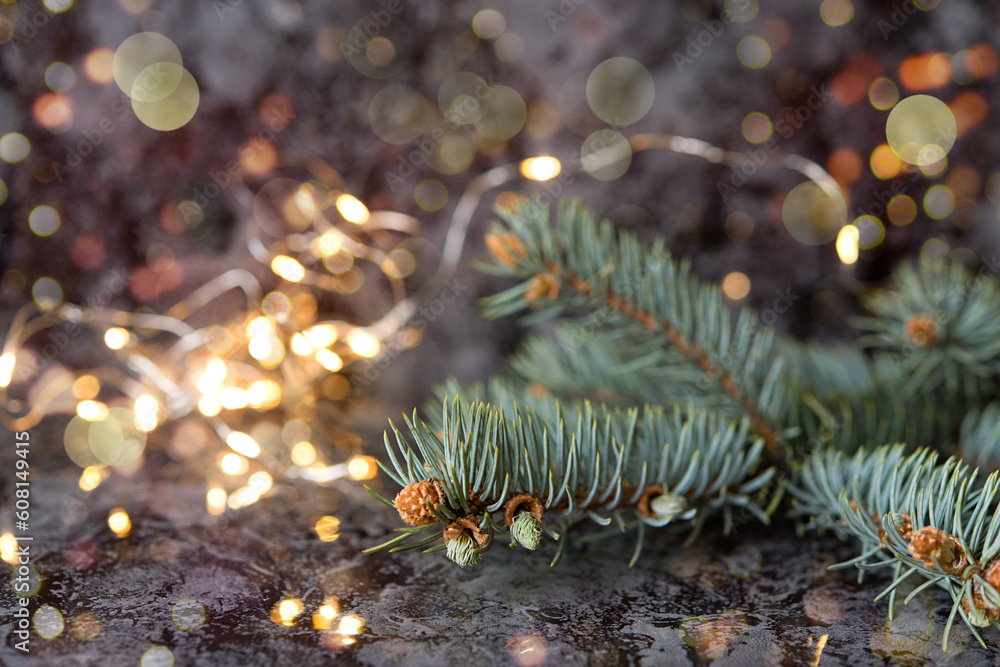 Poster Fir tree branch close up photo with lights bokeh. Christmas background