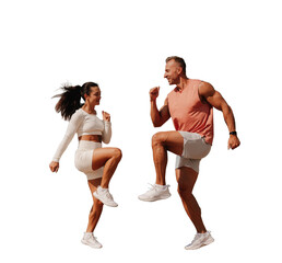 Young brunette woman in white sportswear jumping with trainer against transparent background. Sport, fitness, exercise. Tanned European strong man at exercise with wife.