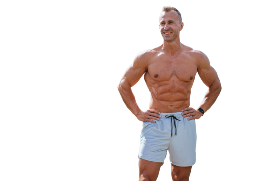 Strong young adult caucasian man in sportswear shorts stands against transparent background. Cheerful bodybuilder smiles looks away.