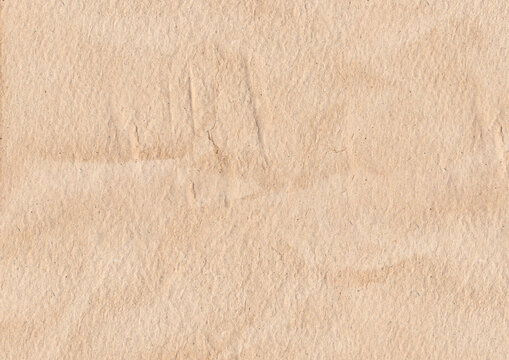 Wrinkled brown paper with textured fish scales on the surface of the paper. Recycle brown paper crumpled texture. Old paper surface for background.