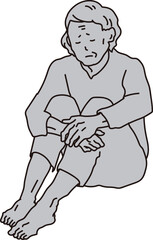 孤独に座る高齢者女性