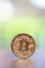 Bitcoin on defocused background.