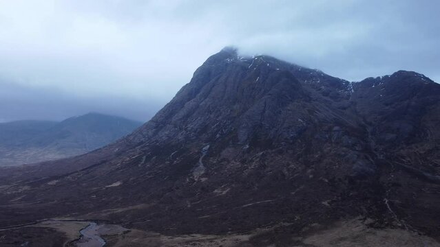Mist covered mountains of Glencoe early morning captured by drone