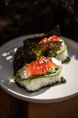 Portion of japanese hand rolls with caviar and avocado