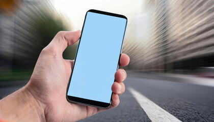 hand with mobile with blue background in the city