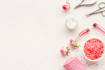Pink roses flowers and manicure tools. Beauty nail care spa salon.