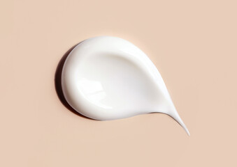 cosmetic smears of creamy texture on a beige background