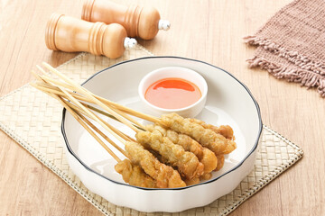 Sempol Ayam, made from minced chicken, spices and eggs. Served with chili sauce. Indonesian traditional food
