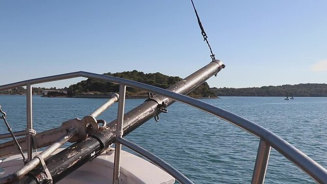 The Bowsprit Of The Yacht Is On The Left Side. View Of The Water From The Bow Of The Ship, Moving Forward Into The Sea.