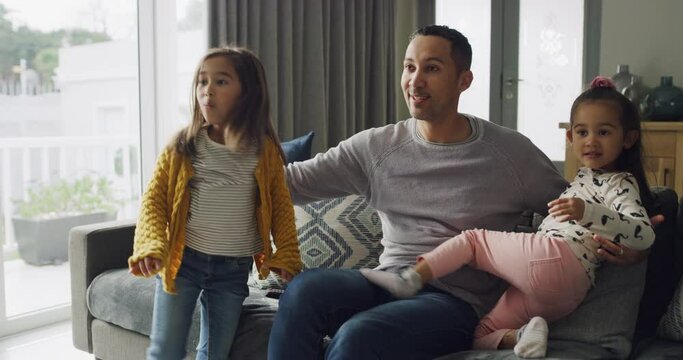 Young children, dad hug and watching tv living room in a family home with love and bonding. Kids, father and youth of a girl with papa together in a house with child movie with happiness in lounge