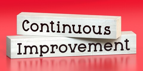 Continuous improvement - words on wooden blocks - 3D illustration