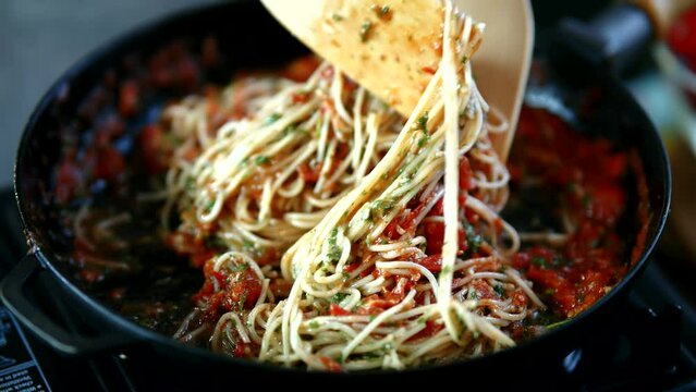 Chef tasting spaghetti Marinara sauce . Italian pasta food