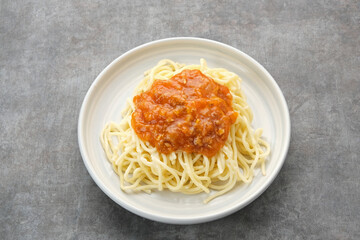 Spaghetti Bolognese on dark background, copy space
