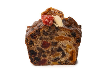 A cake with dried fruits, raisins almonds, dried strawberry.