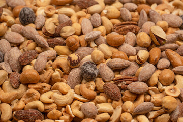 A group of almonds, pistachios, walnuts, macadamia, cashews.