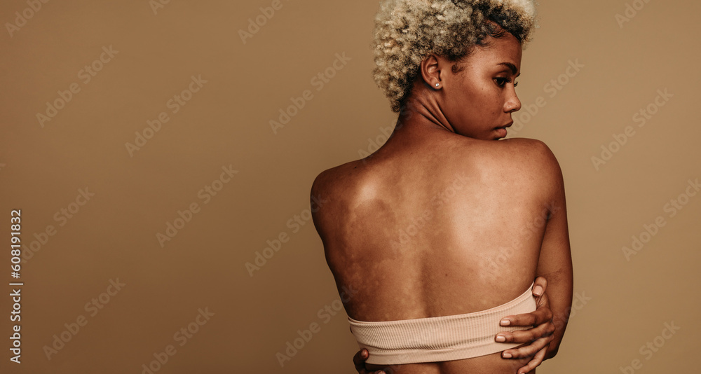 Wall mural Confident Gen Z woman embracing her unique skin tone