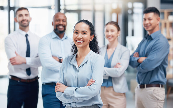Smile, group of business people in portrait with woman boss, confidence and pride at project management company. Teamwork, commitment and vision, happy team with arms crossed in coworking start up.