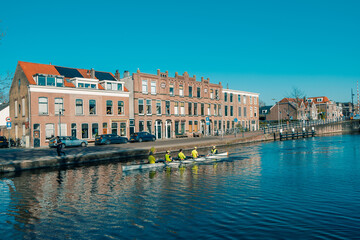 Canals and Brick Houses, Canoe Floats on the River in Delft, Netherlands