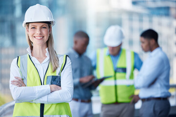 Portrait, arms crossed and a woman construction worker outdoor on a building site with her team in...