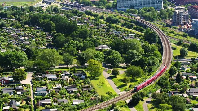 Copenhagen local train driving through area of vacation homes