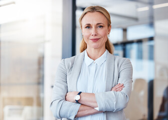Business woman, portrait smile and arms crossed in confidence for small business management at the...