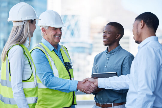 Building deal, happy and people with handshake on site for construction job, logistics and meeting. B2b, support and engineers shaking hands with a black man for a maintenance or inspection contract