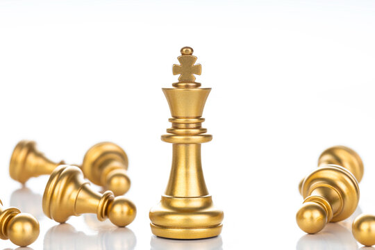 The Golden king chess with pawns on white background. Leader and success concept.