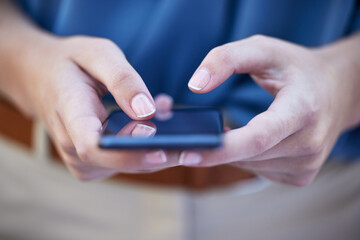 Hands, phone and contact with a woman typing a text message closeup on a blurred background. Mobile, communication and social media with a female person reading a text or networking alone outdoor