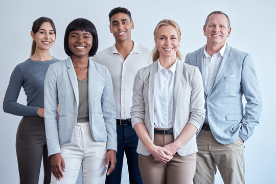 Happy, company diversity and portrait of business people in a legal office for work. Smile, corporate and lawyers on a wall for agency profile, about us or solidarity in the workplace together