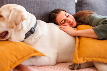 Woman and dog taking a nap